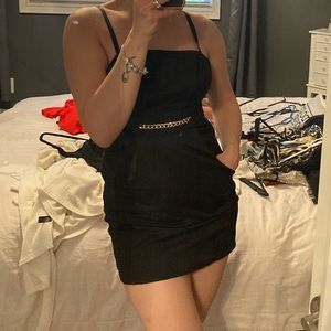 Guess black mini dress with pockets and gold chain.